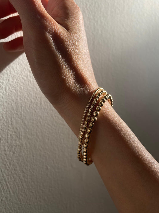 There are 3 gold filled bead bracelets that are made of 14k gold filled 2mm, 3mm and 4mm beads