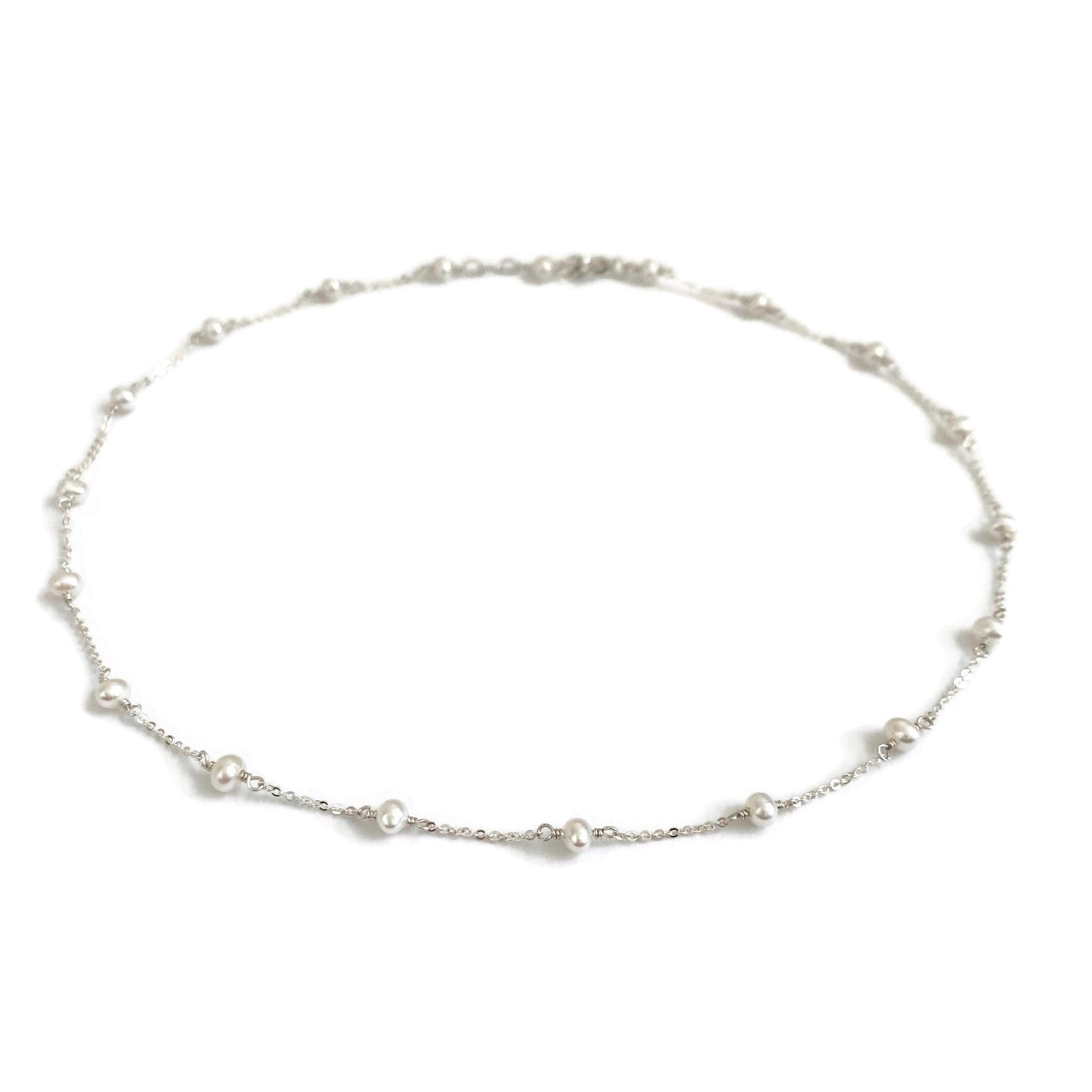 This pearl choker necklace is dainty and made of sterling silver chain with genuine fresh water pearl.