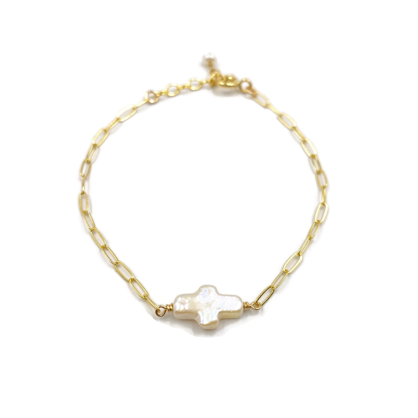This is a pearl cross bracelet that's made of fresh water pearl cross bead with 14k gold paperclip chain.