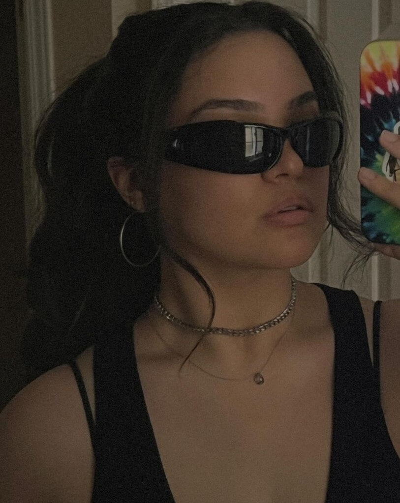 In this picture, there is a lady wearing the Black Tourmaline necklace that's made of dainty gold filled chain. Photo by Sabrina Marie