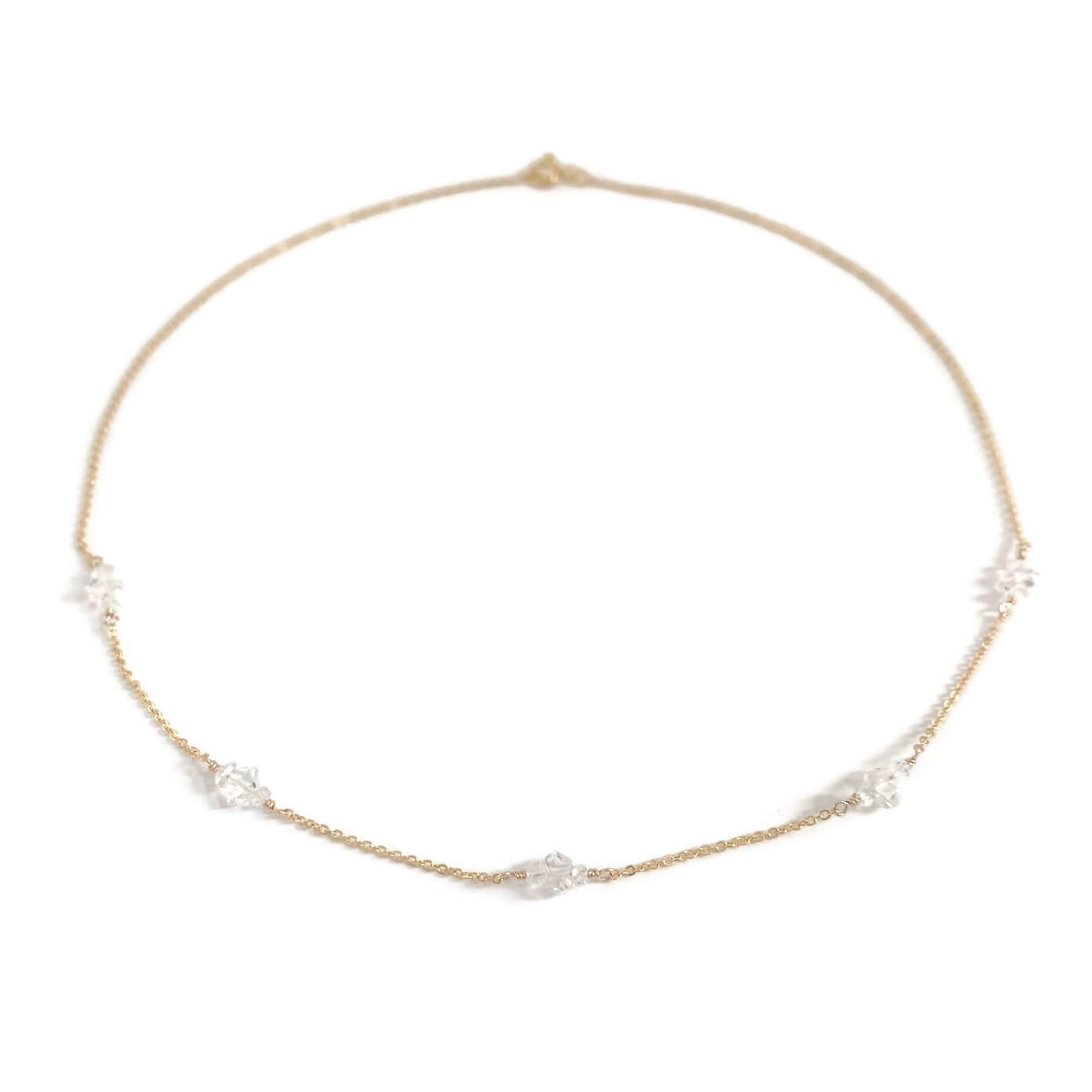 A delicate herkimer diamond necklace in 14k gold chain.