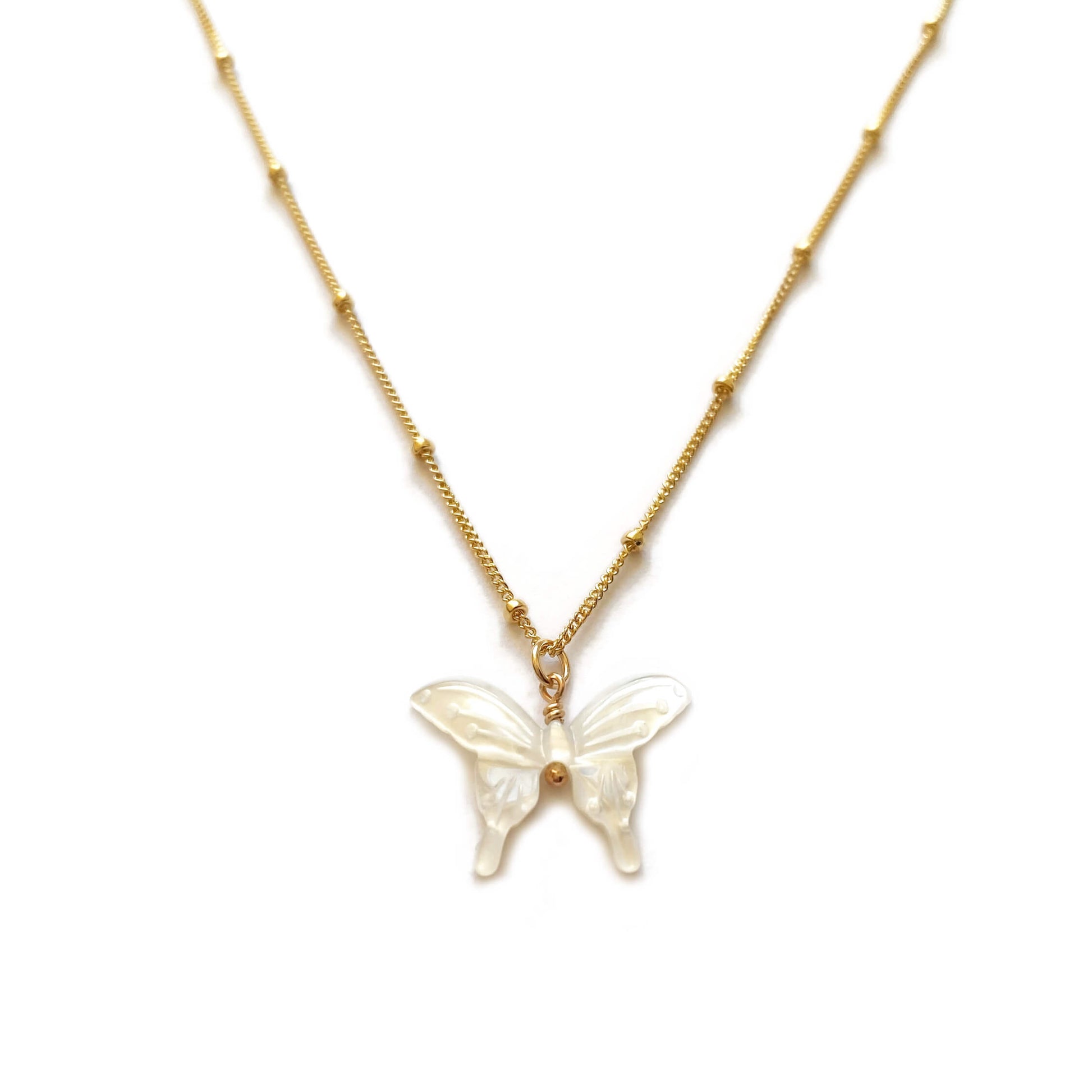 This is a white butterfly necklace that's made of MOP butterfly charm and 14k gold chain.