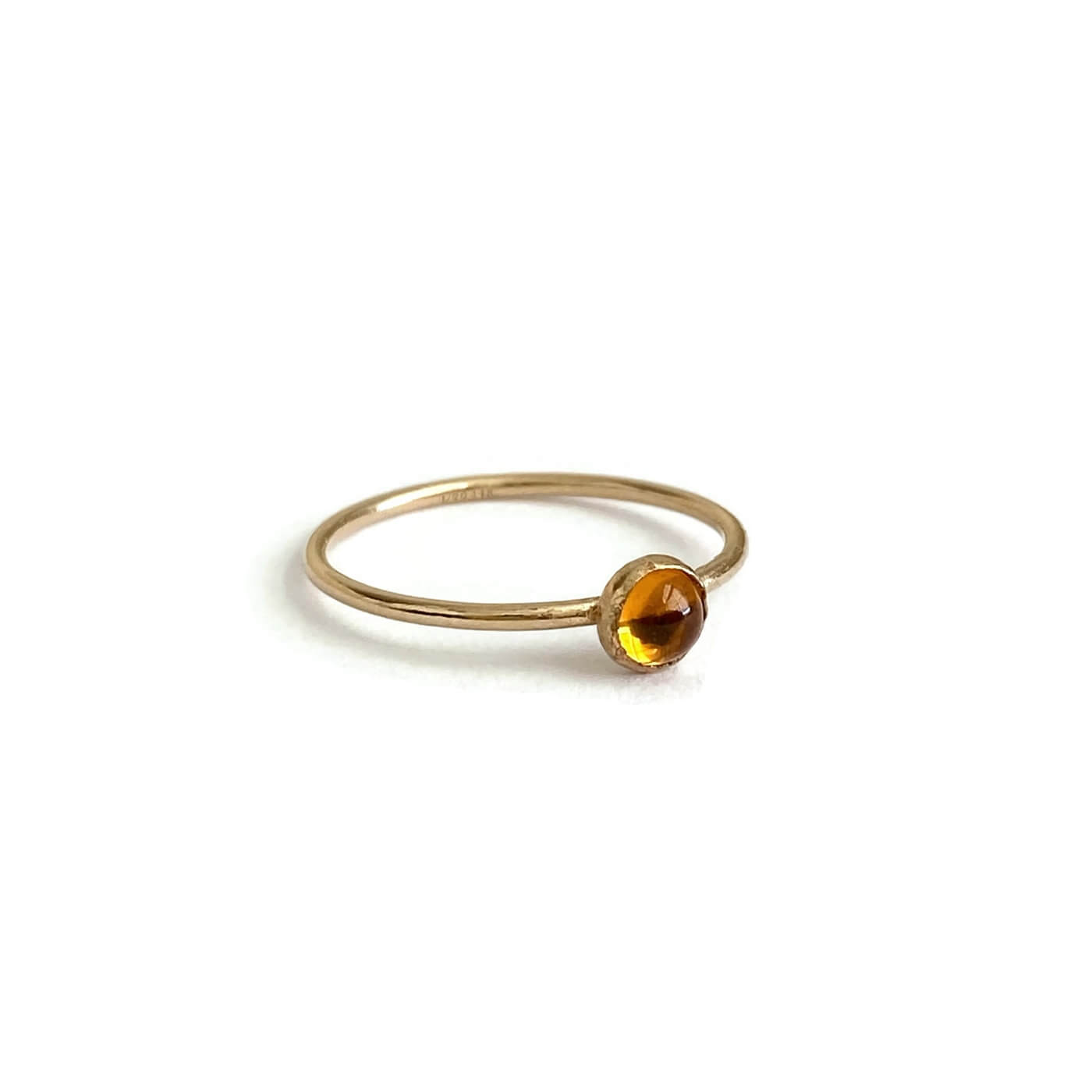 This is a dainty gold filled citrine ring that is made of 4mm citrine and gold filled wire.