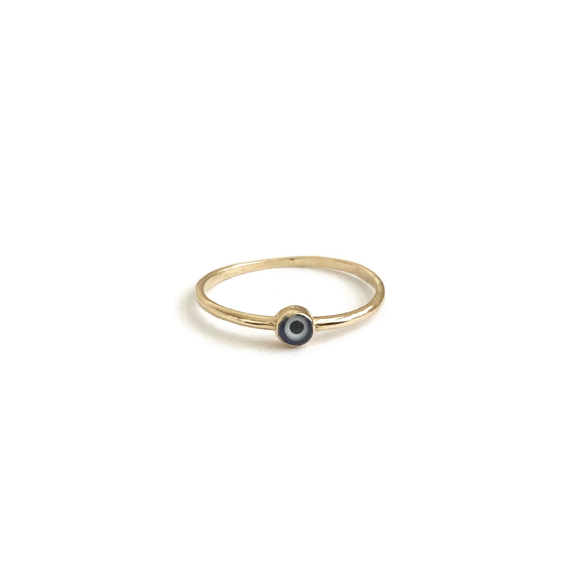 This is a dainty 14k solid gold evil eye ring.
