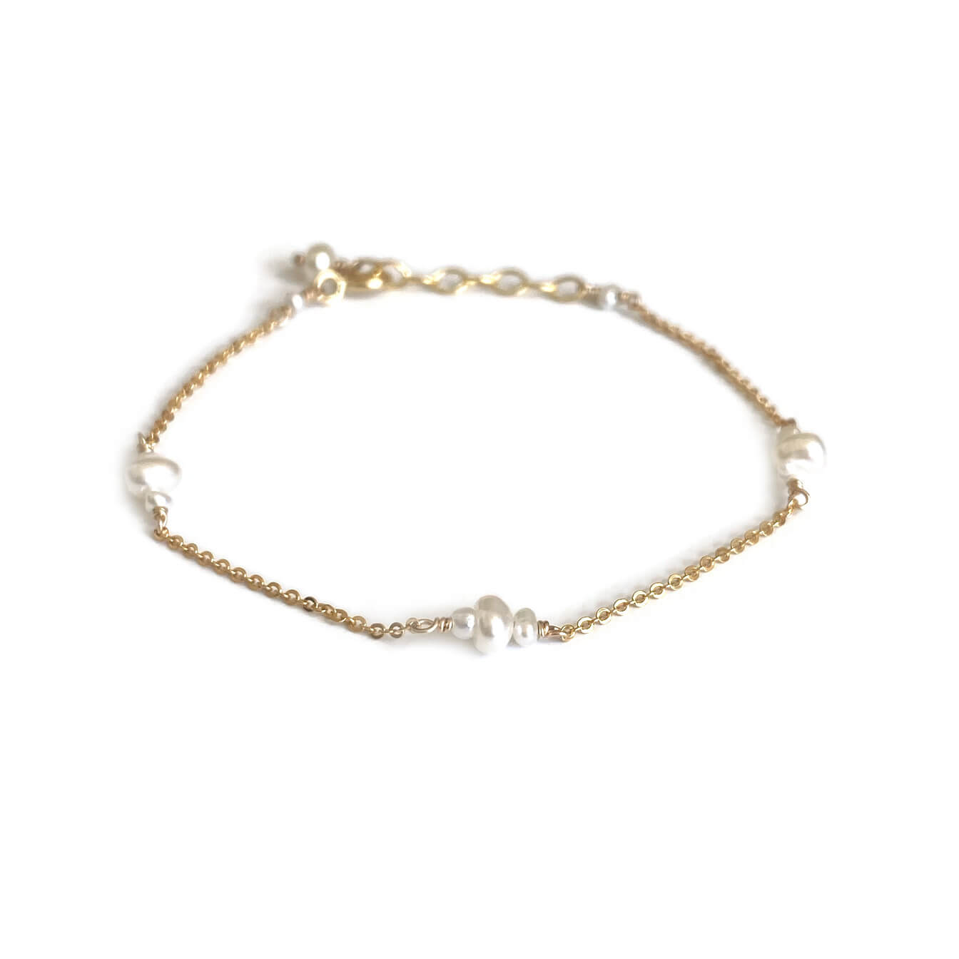 This is a dainty pearl bracelet that is made of 12 fresh water pearls with dainty gold chain. It can be made in 14k solid gold, sterling silver or gold filled chain.