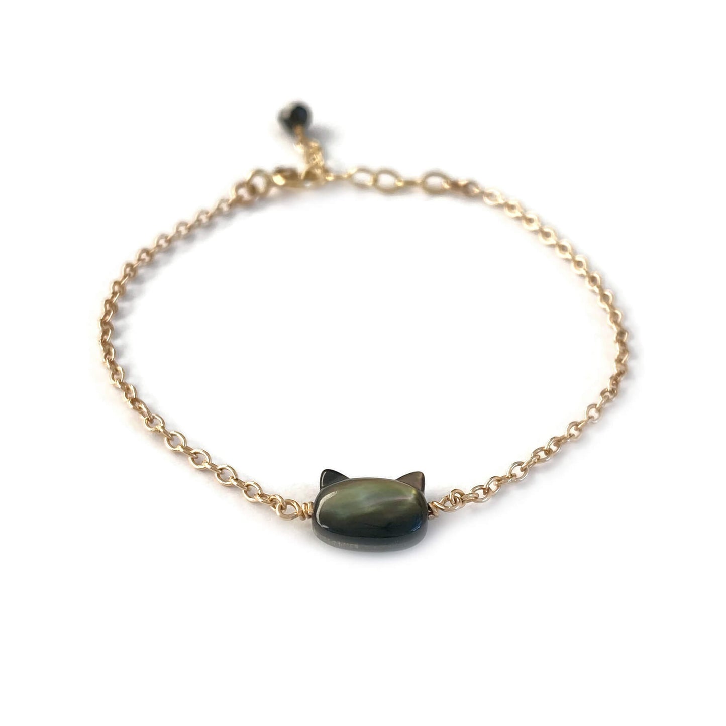 This is a black cat bracelet that is made of genuine black mother of pearl from Tahiti and gold filled chain. It's adjustable 6" to 7" with a dangling Black Tourmaline.
