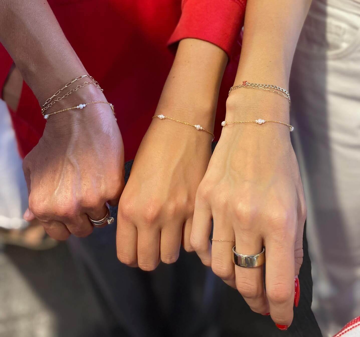 Mother and daughters wearing our dainty pearl bracelets that's made of genuine pearls.