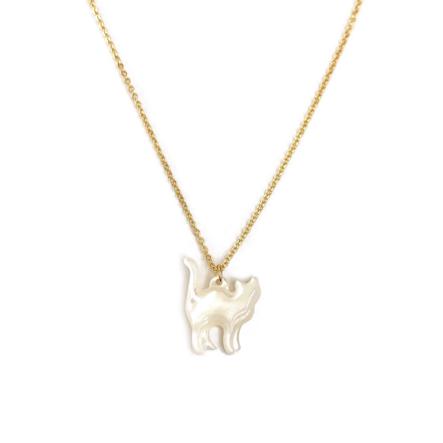 This is a white cat necklace that is made of mother of pearl on a 14k gold chain.