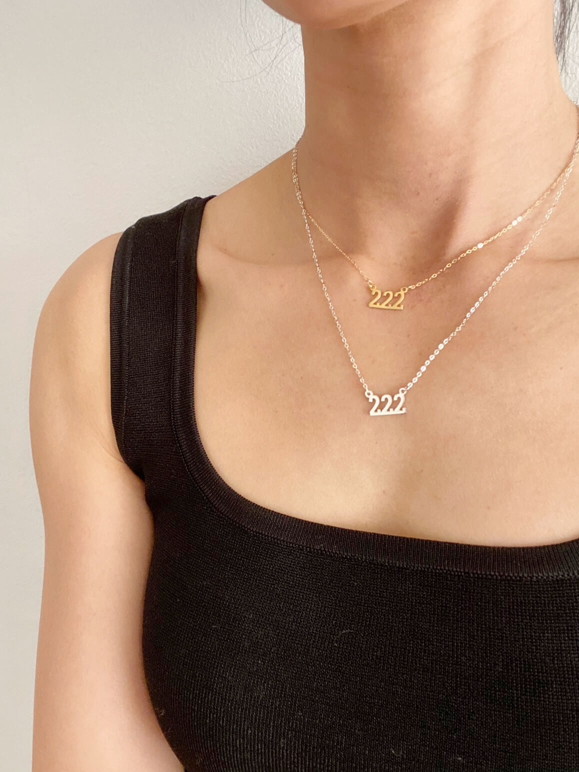 There are 2 of 222 necklaces in this picture. The first one is the gold 222 Angel necklace that is made of gold filled material. It' is 16" long. The second necklace is a silver 222 Angel necklace that is 18" long.