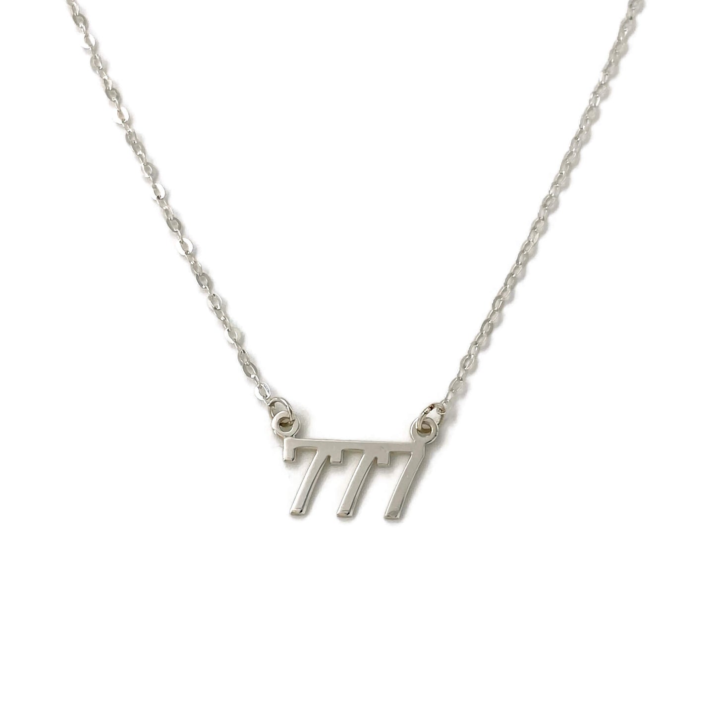 This is a silver 777 Angel number necklace that is made of sterling silver 777 charm and dainty sterling silver chain.