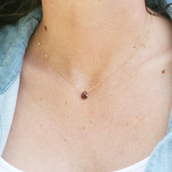 This garnet stone necklace is adjustable.  You can wear it as a choker at the shorter length.  It's great gift idea for girl or women who like dainty jewelry. 