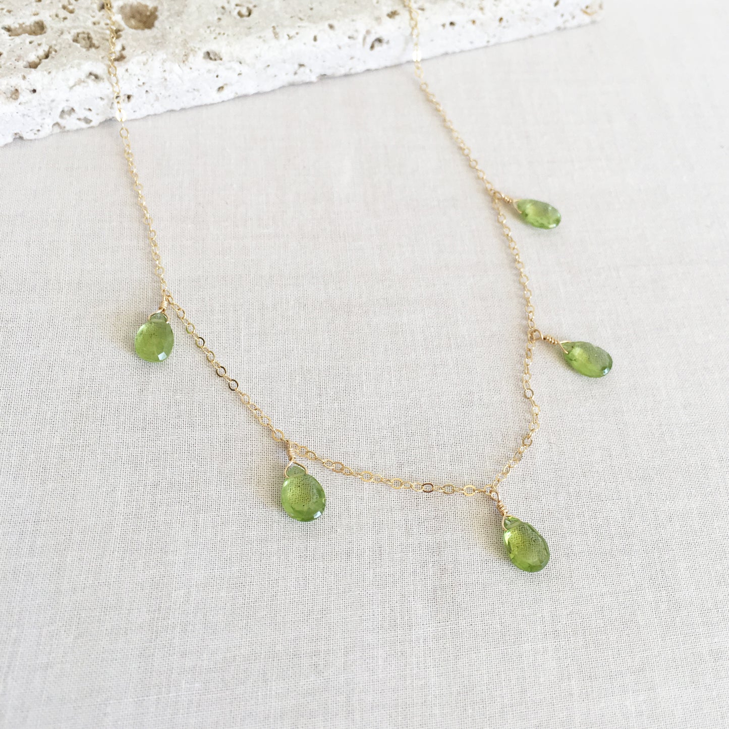 This peridot necklace is made of 14k gold chain with 5 genuine peridot gemstone crystal.