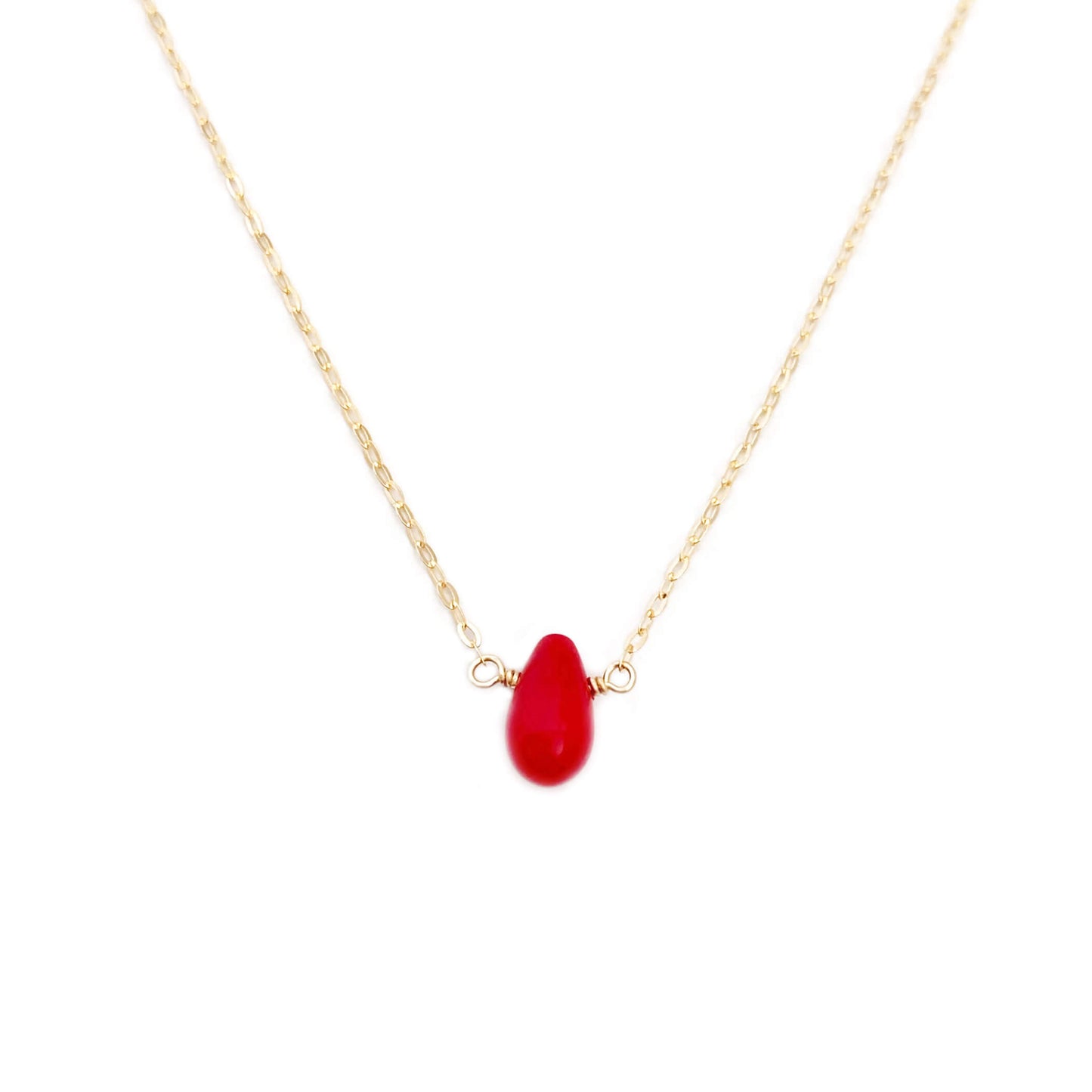 This dainty red coral necklace is made with a single piece of red coral gemstone - a brighter shade of red compared to a ruby. Perfect for a more casual and fun look, the chain for this necklace can be made in several different materials.