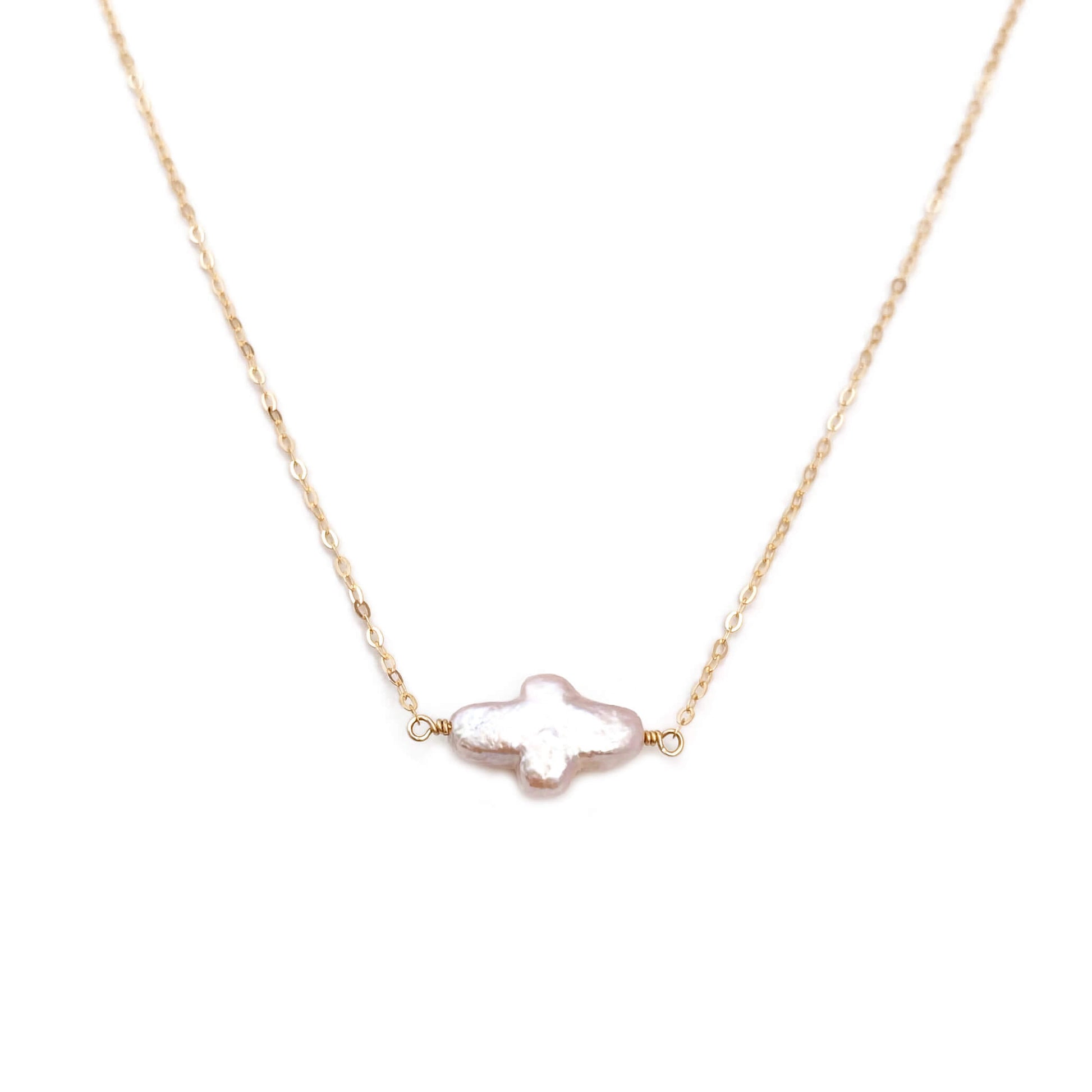 The sideway cross necklace is simple yet elegant, made using hand selected fresh water pearl.