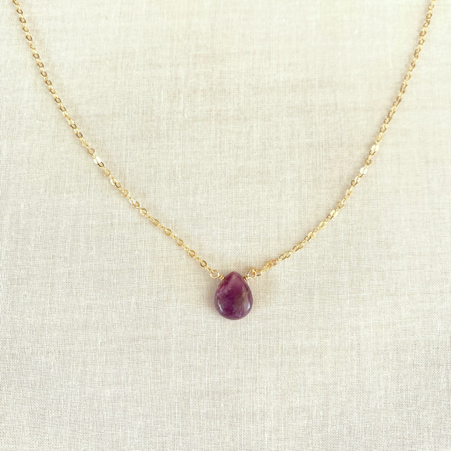 This Lepidolite necklace is made of genuine Lepidolite  with gold chain. It look very similar to Amethyst but it's a totally different crystal.