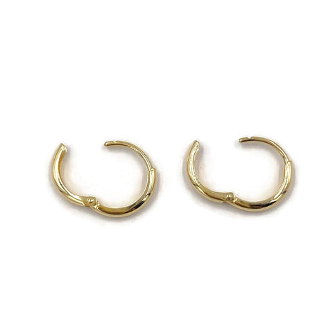 This is a pair of 14k solid gold huggie earrings that are open. 