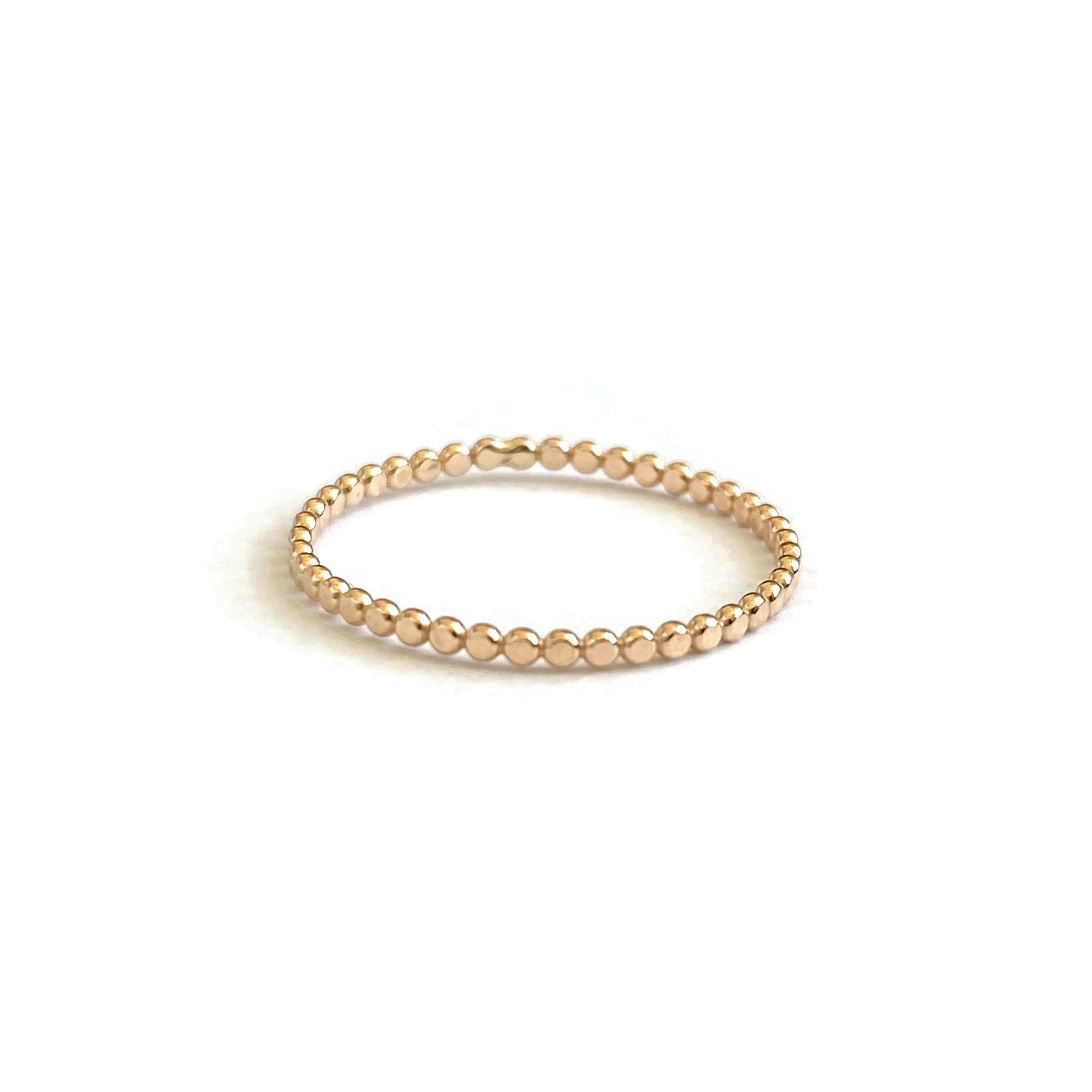 This is a 14k solid gold dot ring. It's available for size 4 to size 9. 