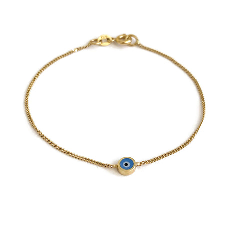 This is a 14k solid gold evil eye bracelet that is made of 14k solid gold.