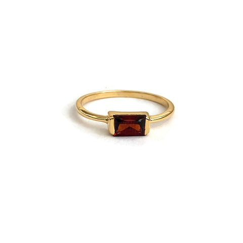 This is a Baguette Garnet Ring featuring a genuine garnet stone, this ring is available in sizes 5-8 and is crafted with a thick 3-micron gold vermeil