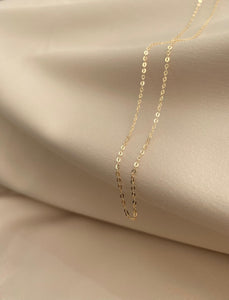This is a dainty 14k solid gold chain necklace that is made in Italy