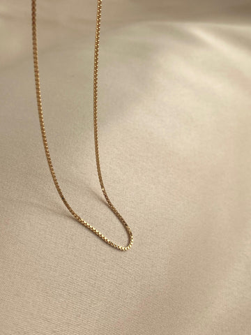 This is a 14k solid gold box chain necklace that is made in Italy.