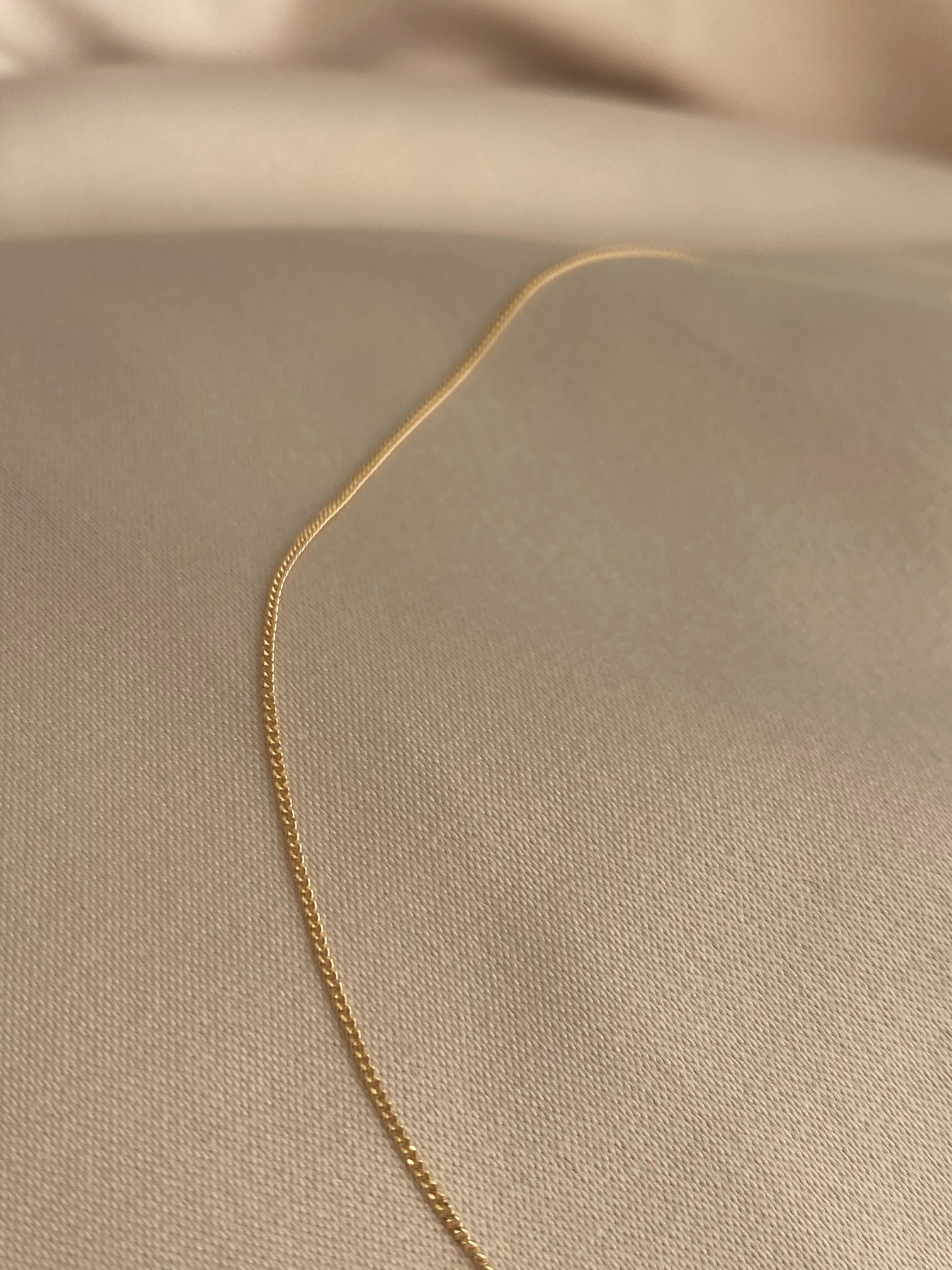 This is a 14k dainty curb chain that is made of 14k solid gold. It's made in Italy by a third generation gold chain family business.  
