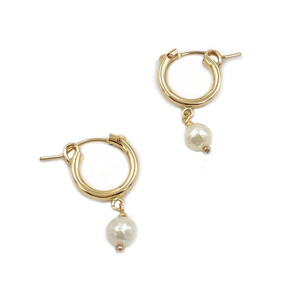 Freshwater pearl gold hoop earrings that are made of 14k gold filled material. 