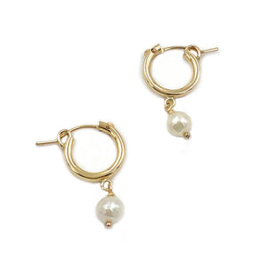 Freshwater pearl gold hoop earrings that are made of 14k gold filled material. 