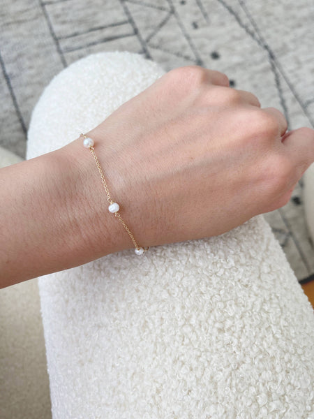 This is a dainty fresh water pearl bracelet that's made in our san francsico jewelry studio.