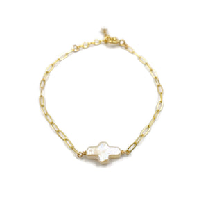 This is a pearl cross bracelet that's made of fresh water pearl cross bead with 14k gold paperclip chain. 