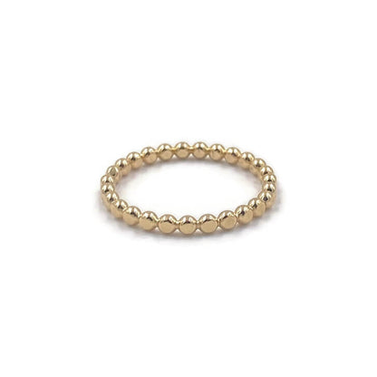 This is a gold hammer dot ring that is stackable.