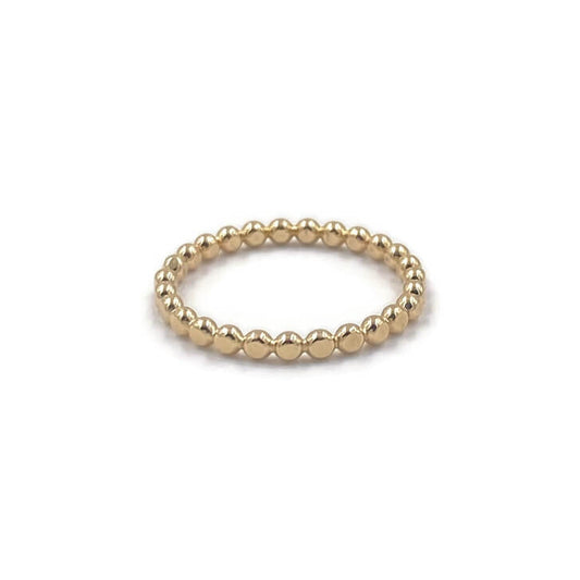 This is a gold hammer dot ring that is stackable.