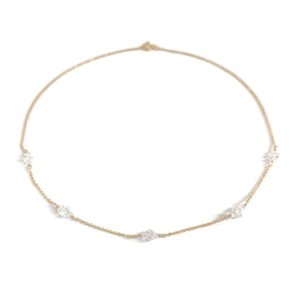 A delicate herkimer diamond necklace in 14k gold chain.