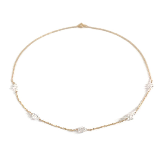 A delicate herkimer diamond necklace in 14k gold chain.