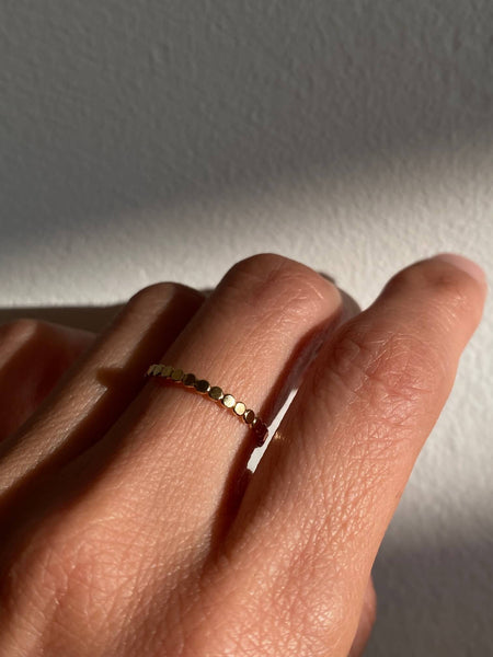This is a gold filled dot ring that is made of gold filled dot wire. 