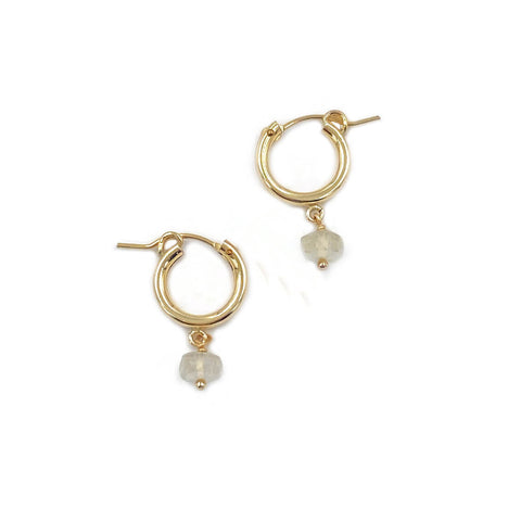 This is a pair of gold Libyan Desert glass hoop earrings.