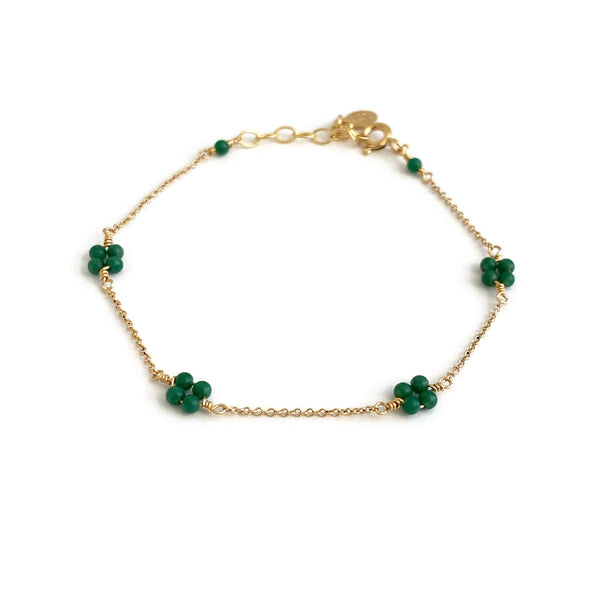 This is a dainty Jade bracelet that is part of our Mia Collection. The four petals symbolize aspects of life - growth, love, renewal, and transformation. 