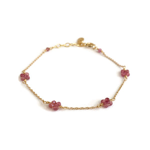 This is a pink tourmaline bracelet that can be made in 14k solid gold, gold filled or sterling silver chain. The four beads as they are petals symbolize aspects of life - growth, love, renewal, and transformation.