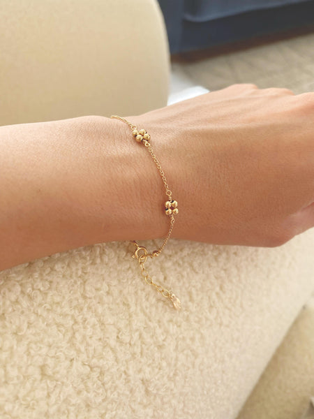 This gold flower bead bracelet is made of gold filled beads with gold filled chain. The 4 beads represent 4 petals symbolize aspects of life - growth, love, renewal, and transformation.