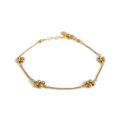 This is a gold bead bracelet that's made of gold filled beads or 14k solid gold beads. The 4 beads represent 4 petals symbolize aspects of life - growth, love, renewal, and transformation.