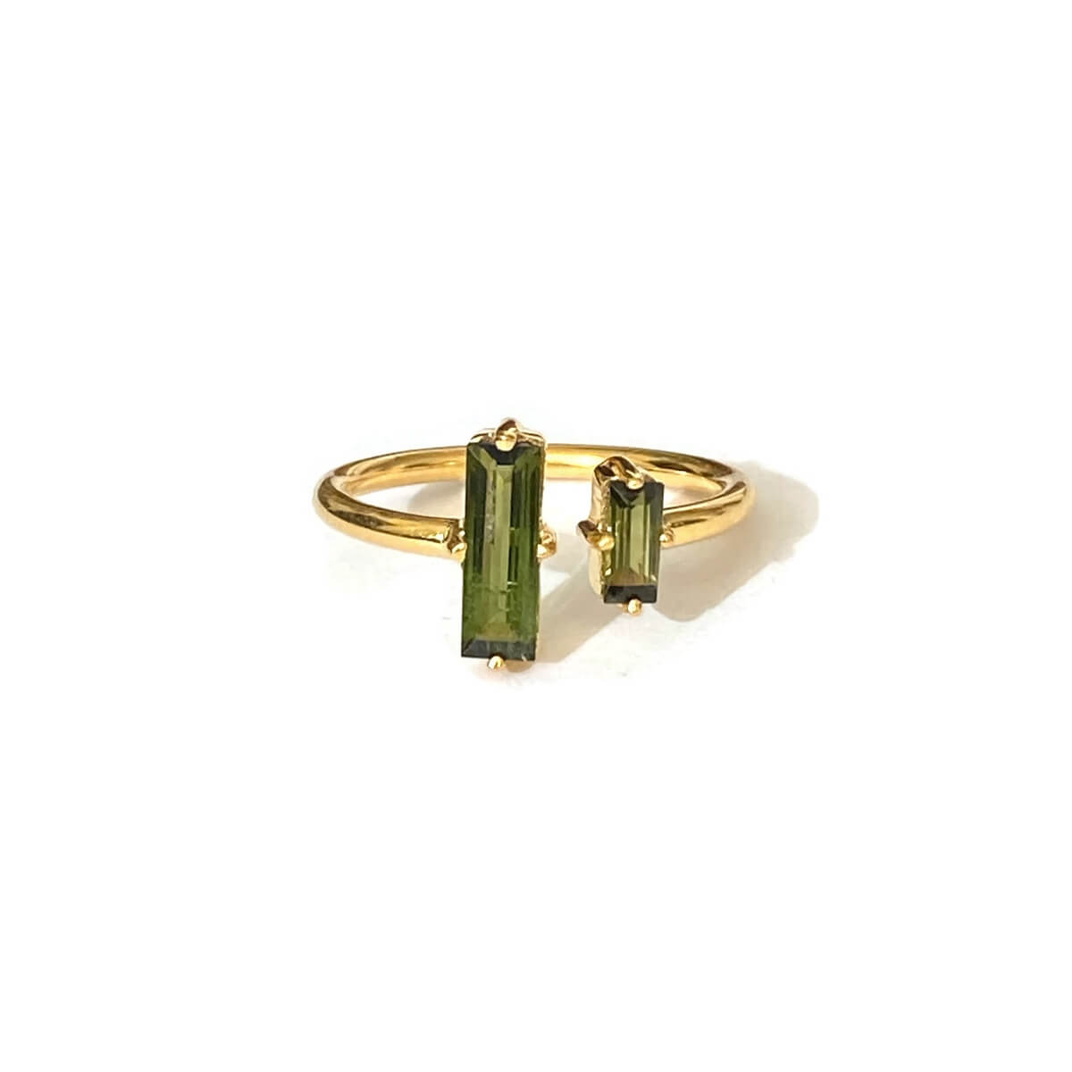 This is a green tourmaline gold ring that is made of sterling silver plated with thick layer of 18k solid gold 