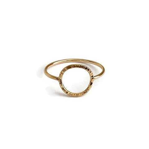 This is a gold filled ring with a circle that has hammered texture. It's dainty and made of thin gauge wire. 