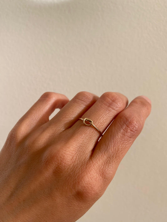 This is a gold love knot ring that is made of 1mm gold filled wire
