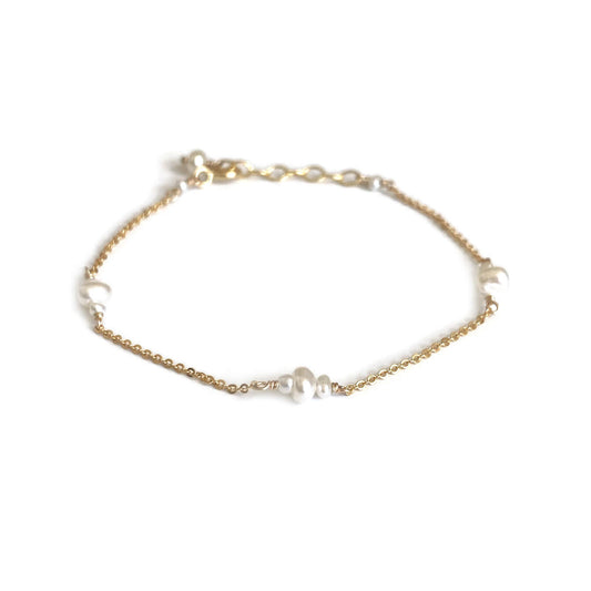 This is a dainty pearl bracelet that is made of 12 fresh water pearls with dainty gold chain. It can be made in 14k solid gold, sterling silver or gold filled chain.  