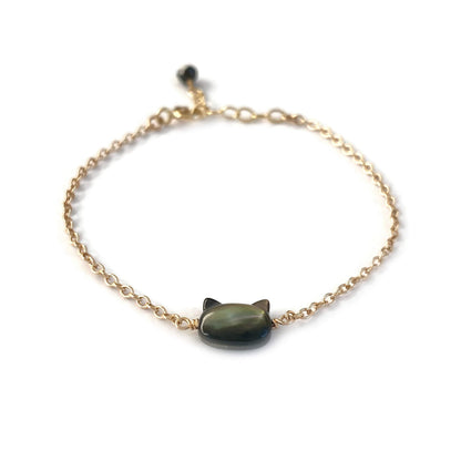 This is a black cat bracelet that is made of genuine black mother of pearl from Tahiti and gold filled chain. It's adjustable 6" to 7" with a dangling Black Tourmaline. 