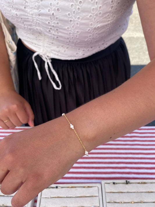This is a dainty pearl bracelet that is made of genuine fresh water pearl and gold filled chain