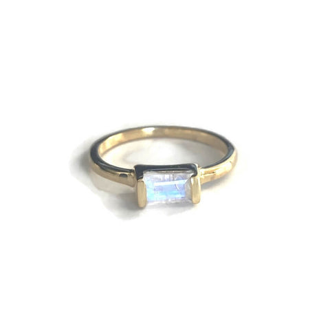 This is a gold moonstone ring that is made of genuine moonstone with gold vermeil over sterling silver in Baguette  style.