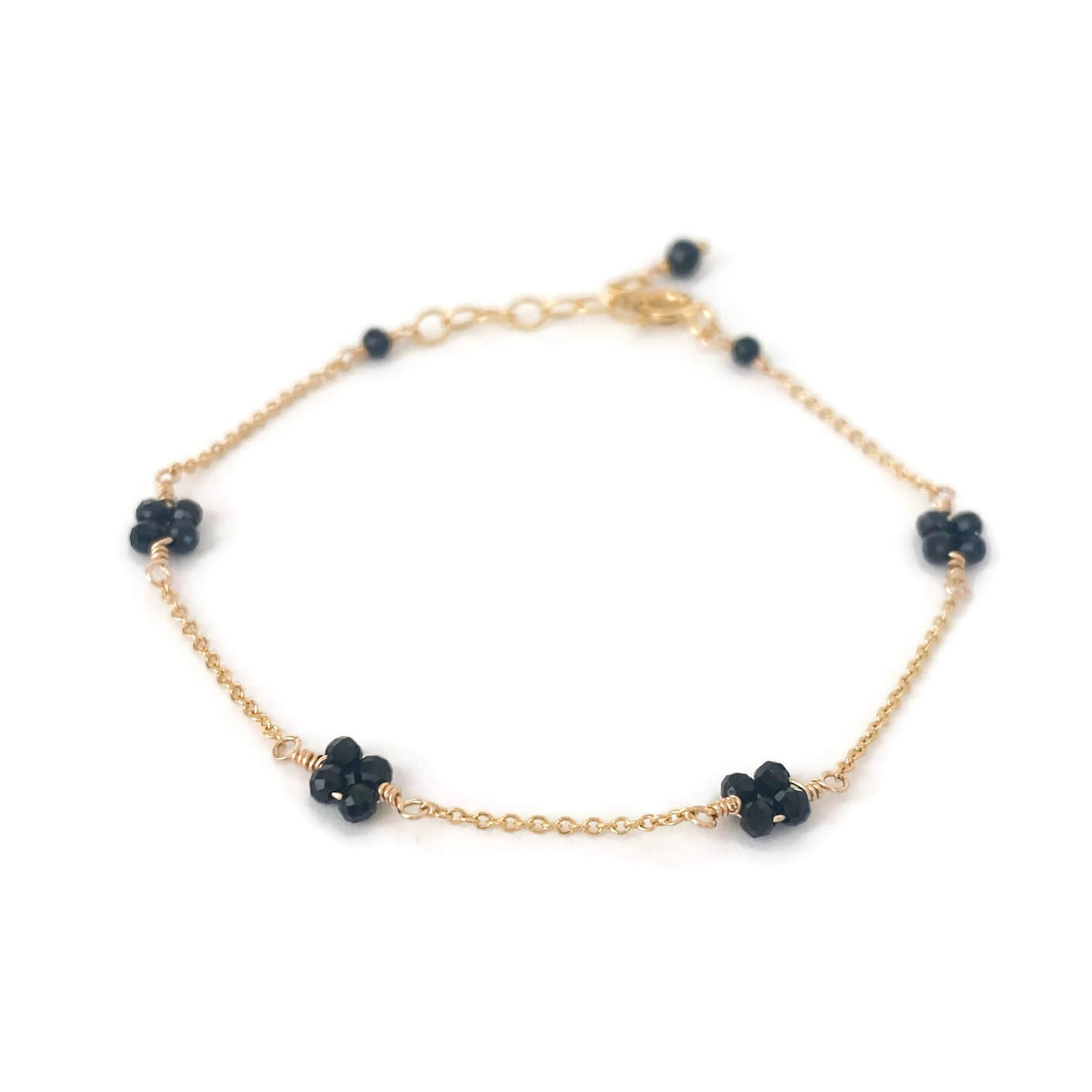 Dainty gold black tourmaline bracelet in flower shape made in gold filled chain