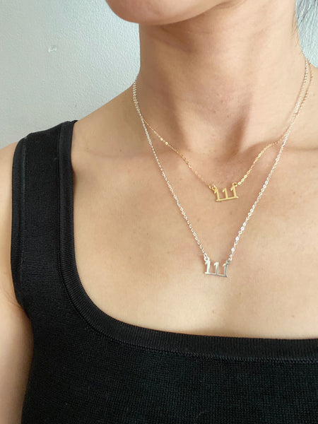 There are 2 of 111 necklaces on the model. The top one is a gold 111 angel number necklace that is 16" long and the second one is a sterling silver 111 Angel necklace that is 18" long.