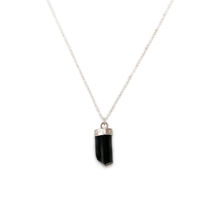 This raw black tourmaline necklace is dainty and made of genuine black tourmaline crystal and sterling silver chain.